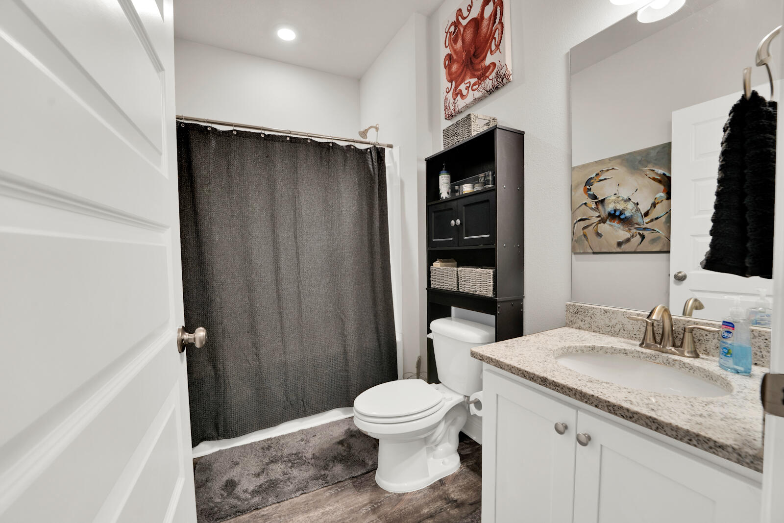 451 Lightning Bug Lane Freeport, FL 32439 - Photo 12 of 47 a bathroom with a granite countertop sink toilet and shower