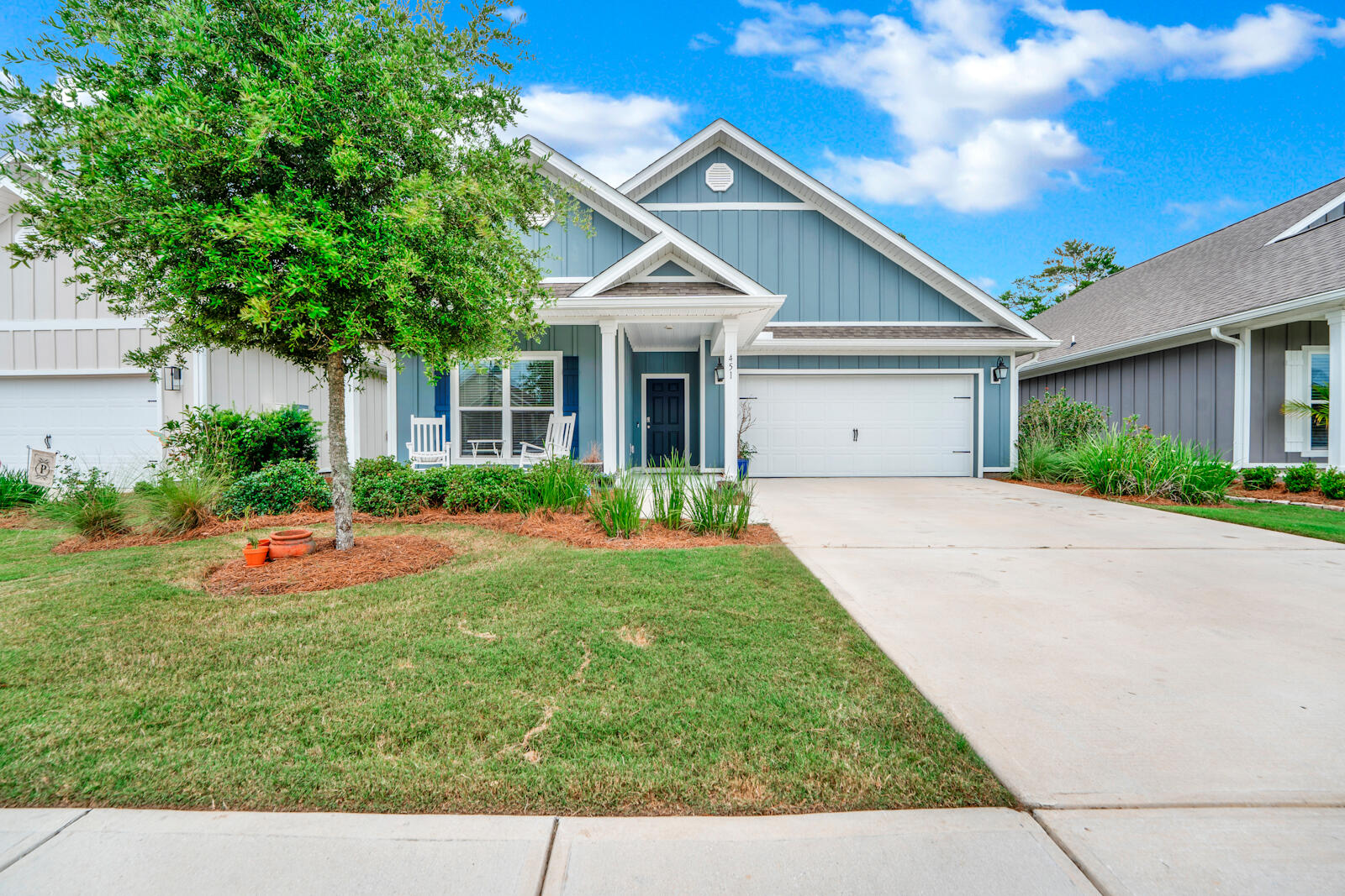 451 Lightning Bug Lane Freeport, FL 32439 - Photo 2 of 47 a view of a house with backyard and garden