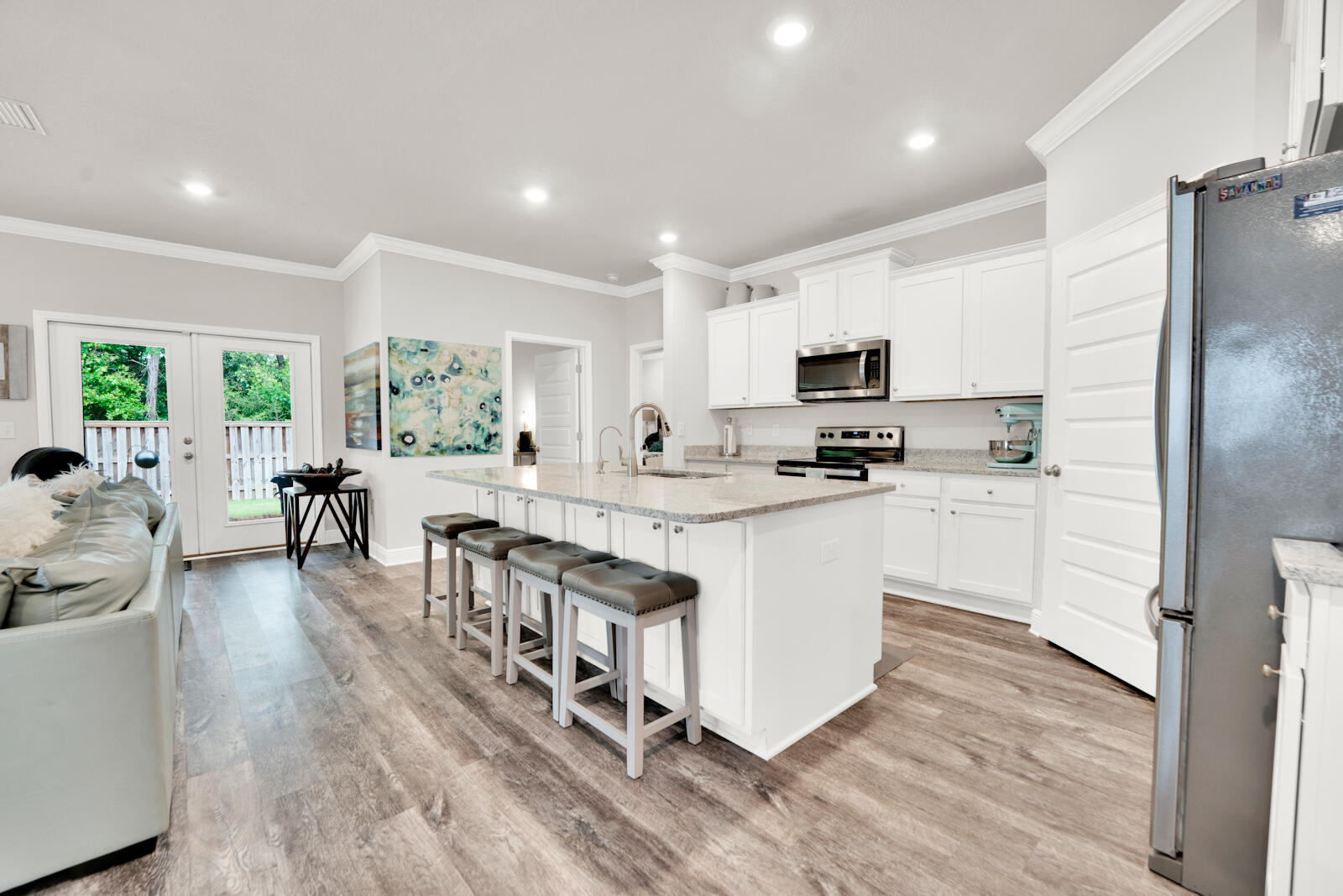 451 Lightning Bug Lane Freeport, FL 32439 - Photo 21 of 47 a kitchen with counter top space a sink cabinets and appliances