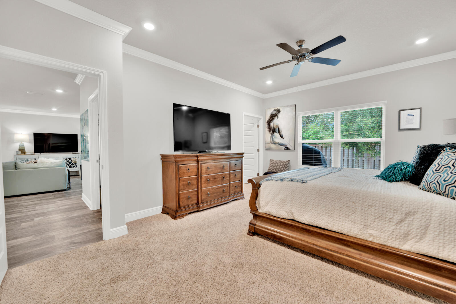 451 Lightning Bug Lane Freeport, FL 32439 - Photo 26 of 47 a spacious bedroom with a bed and a flat screen television