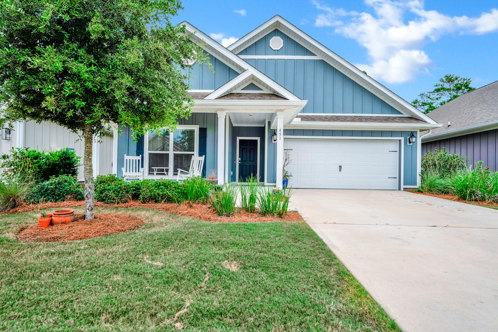 451 Lightning Bug Lane Freeport, FL 32439 - Photo 3 of 47 a front view of house with yard and green space