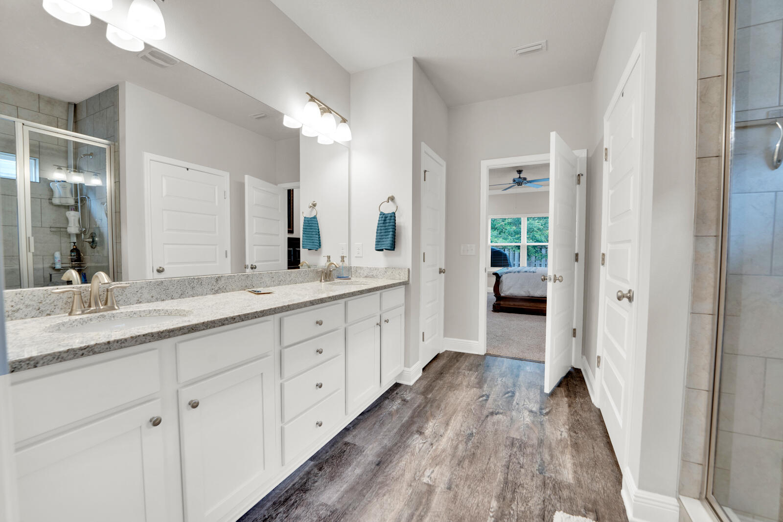 451 Lightning Bug Lane Freeport, FL 32439 - Photo 33 of 47 a spacious en suite bathroom with a double vanity sink and mirror