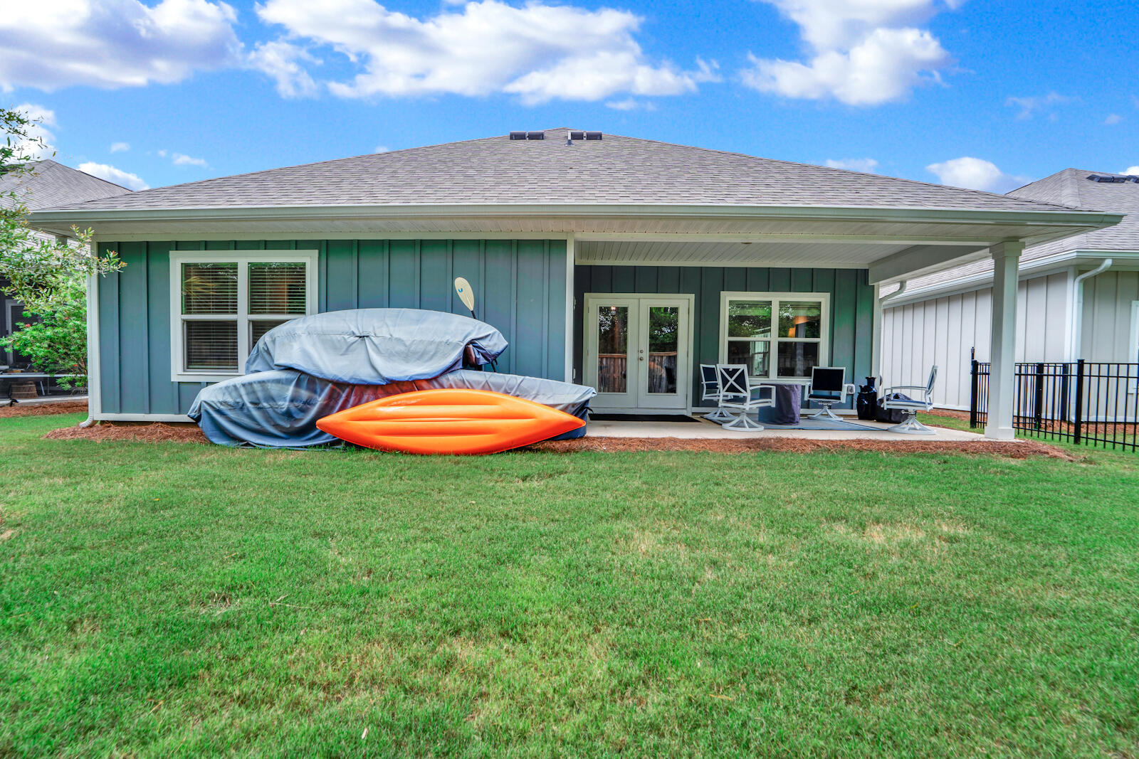 451 Lightning Bug Lane Freeport, FL 32439 - Photo 41 of 47 a backyard of a house with yard table and chairs