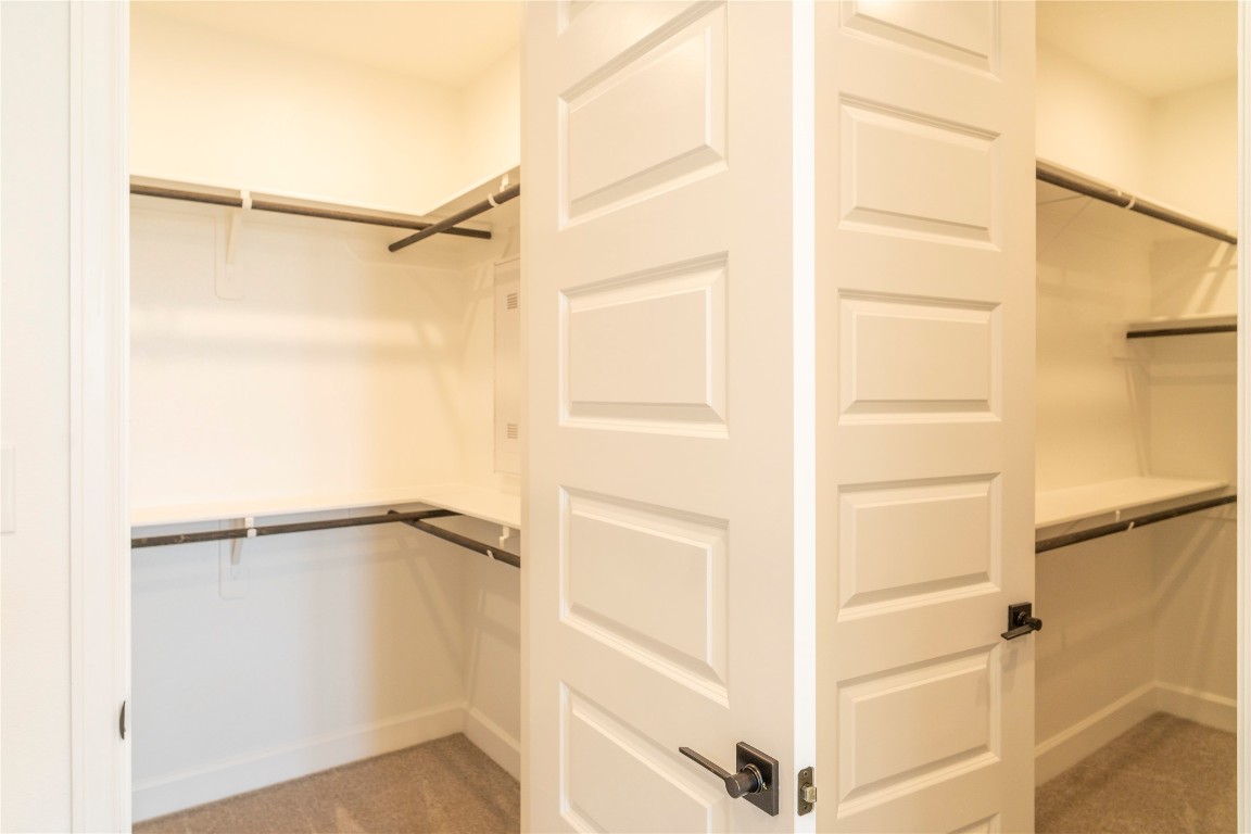 29856 Smoky Ridge Road Fulshear, TX 77441 - Photo 15 of 36 a view of walk in closet with empty racks