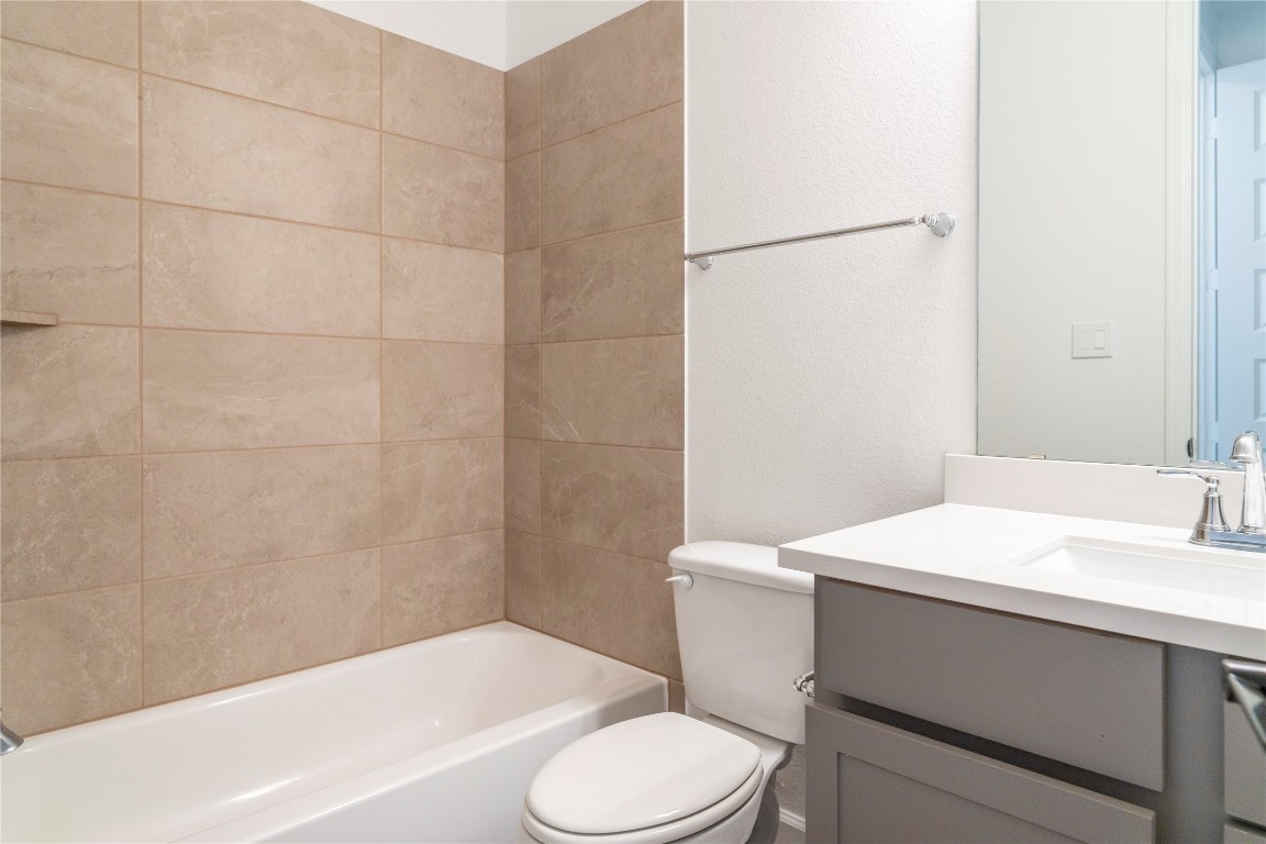 29856 Smoky Ridge Road Fulshear, TX 77441 - Photo 16 of 36 a bathroom with a sink a toilet and shower