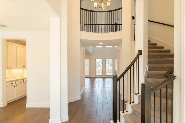 a view of staircase with wooden floor and a window