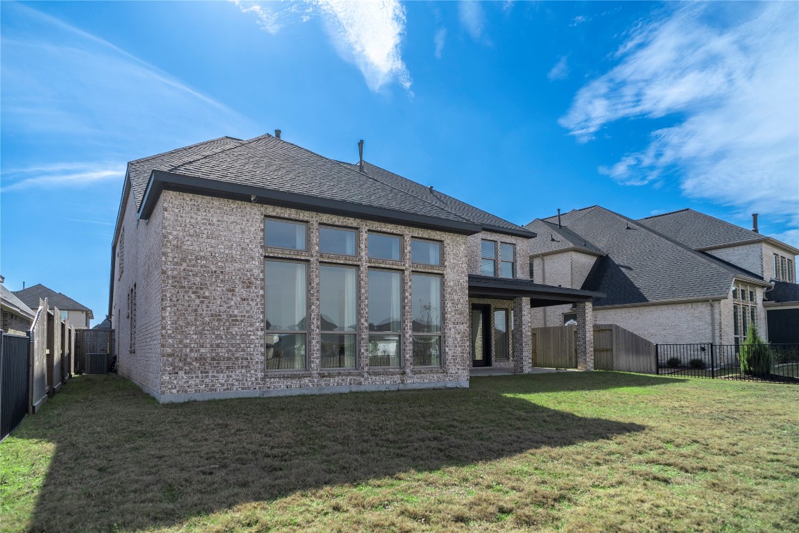 29856 Smoky Ridge Road Fulshear, TX 77441 - Photo 29 of 36 a front view of a house with a yard