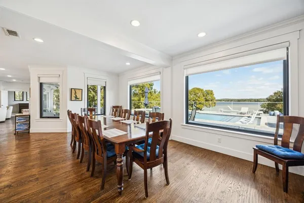 a view of a dining room with furniture window and wooden floor