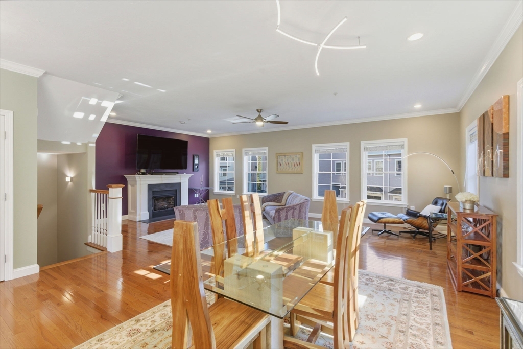 66 Compass Point, Unit 66 North Andover, MA 01845 - Photo 20 of 42 a living room with fireplace furniture and a flat screen tv