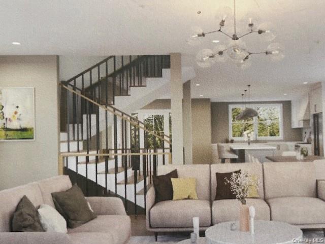 1763 Park Street Peekskill, NY 10566 - Photo 4 of 4 a living room with furniture flowers and a chandelier