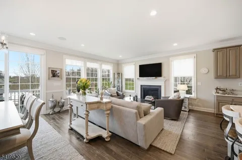 a living room with fireplace furniture and a flat screen tv