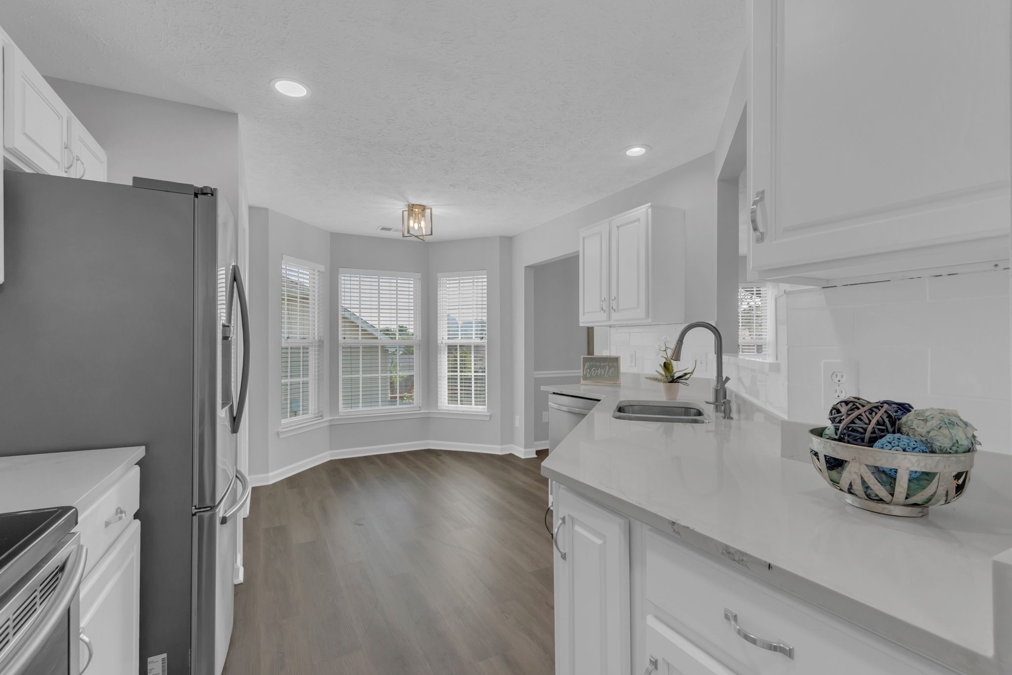 3324 Monoco Drive Spring Hill, TN 37174 - Photo 14 of 31 a kitchen with stainless steel appliances a sink a window and wooden floor
