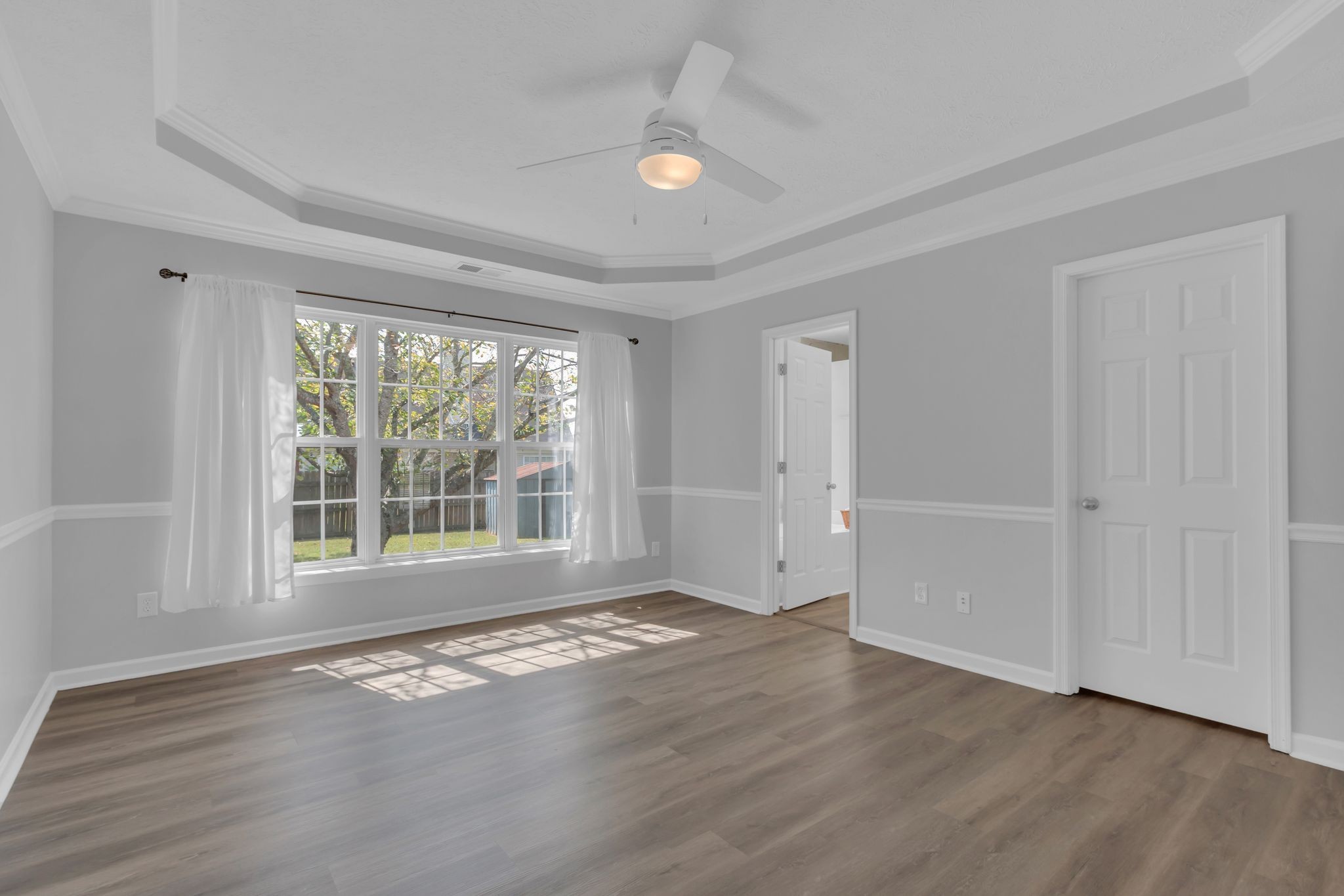 3324 Monoco Drive Spring Hill, TN 37174 - Photo 17 of 31 a view of an empty room with wooden floor and a window