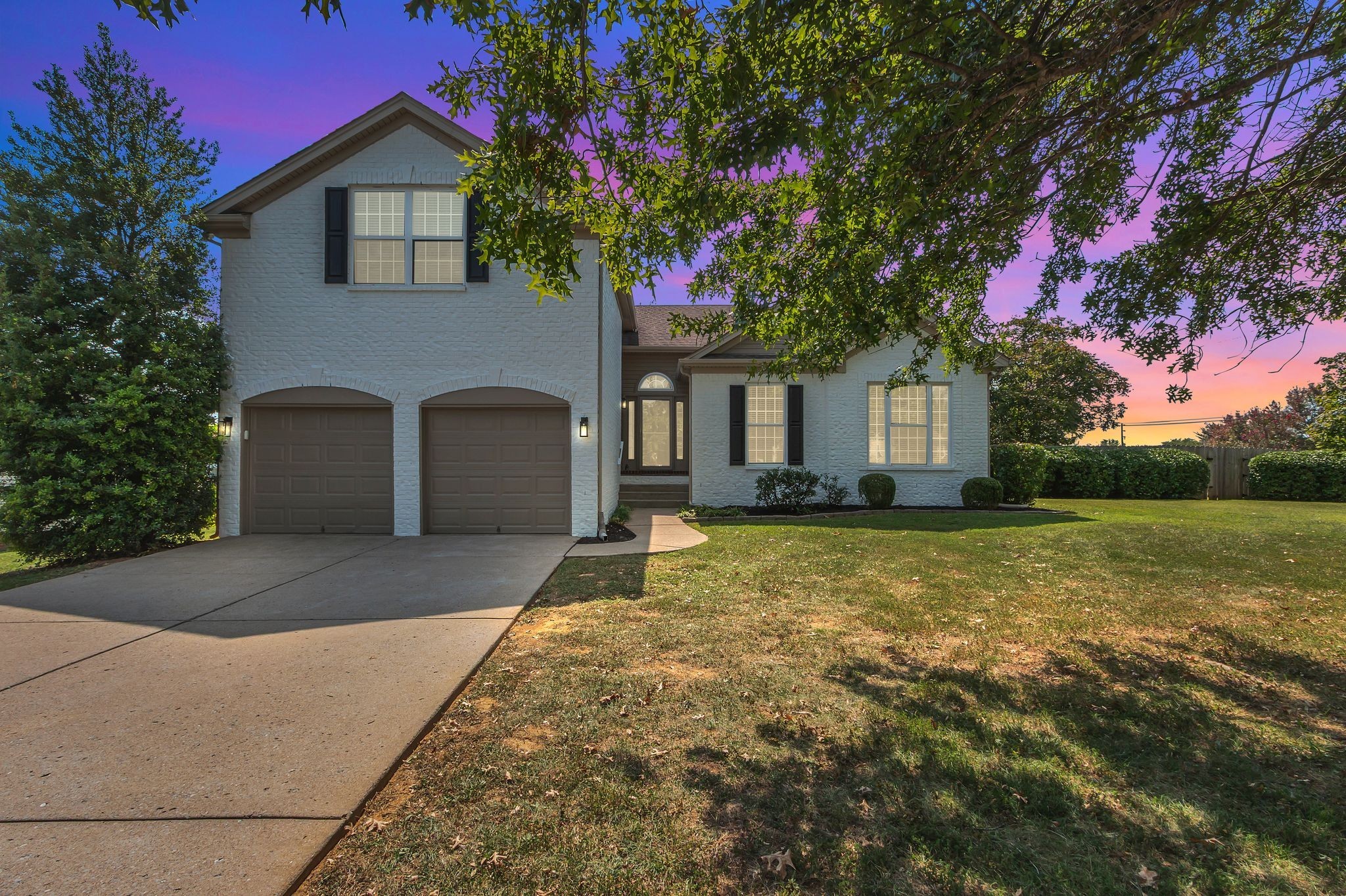 3324 Monoco Drive Spring Hill, TN 37174 - Photo 2 of 31 a front view of a house with garden