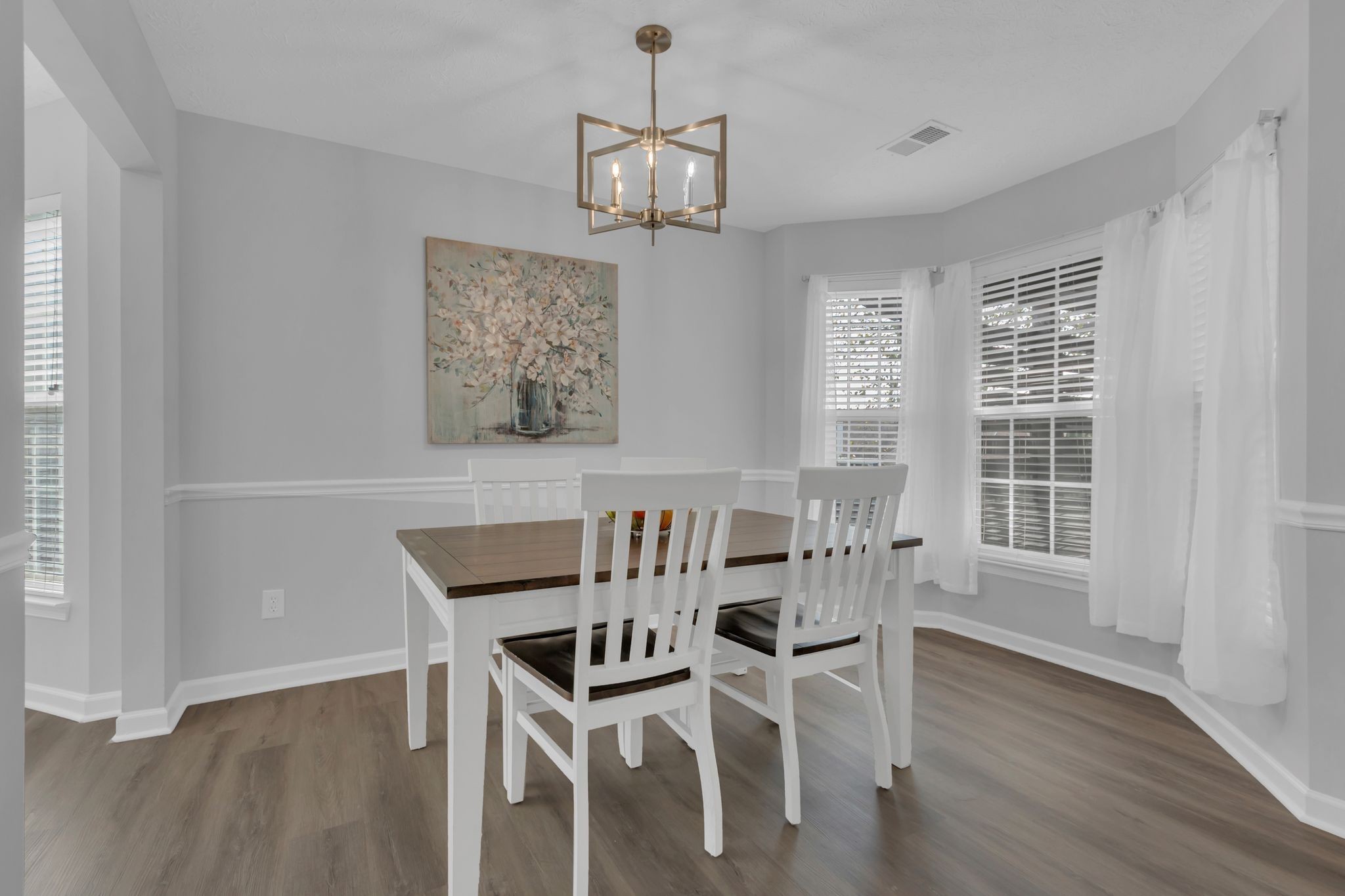 3324 Monoco Drive Spring Hill, TN 37174 - Photo 10 of 31 a view of a dining room with furniture wooden floor and a chandelier