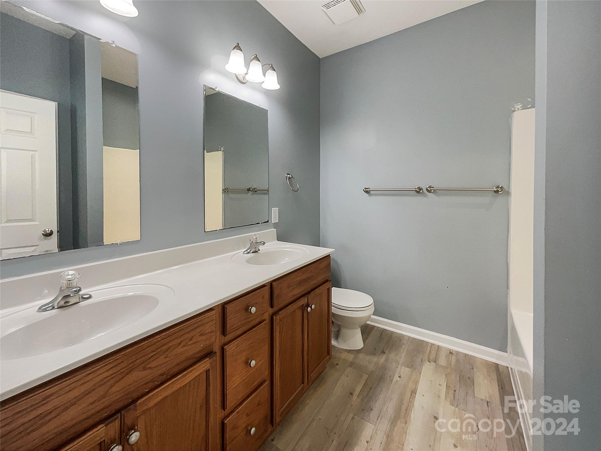 315 Lone Tree Lane Clover, SC 29710 - Photo 15 of 15 a bathroom with a sink a toilet and a mirror