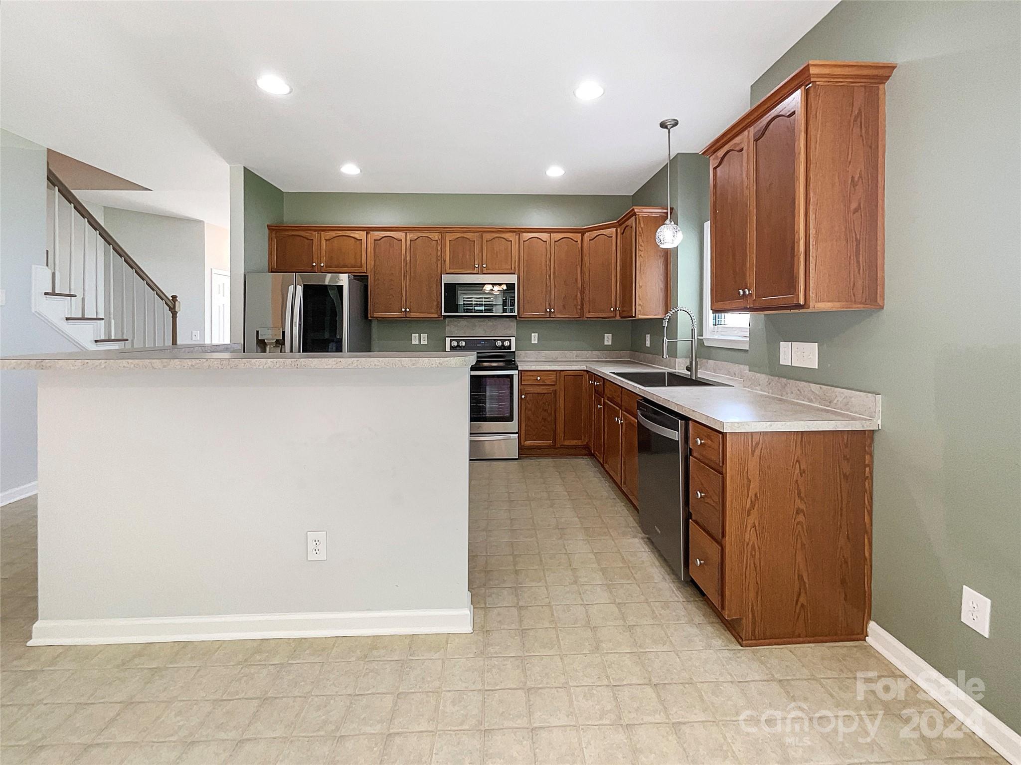 315 Lone Tree Lane Clover, SC 29710 - Photo 2 of 15 a kitchen with stainless steel appliances granite countertop a refrigerator sink and cabinets