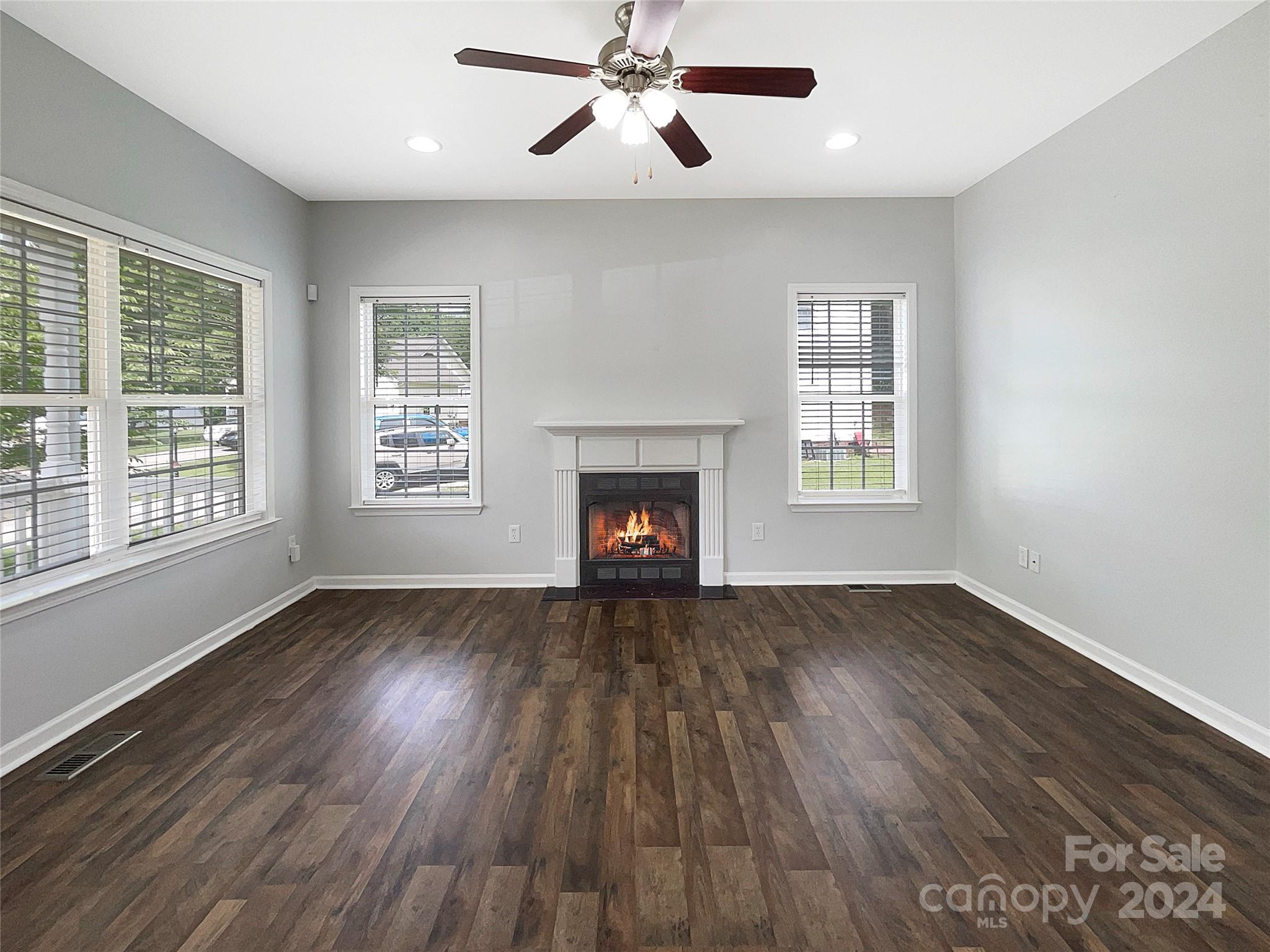 315 Lone Tree Lane Clover, SC 29710 - Photo 4 of 15 a view of an empty room with wooden floor and a window