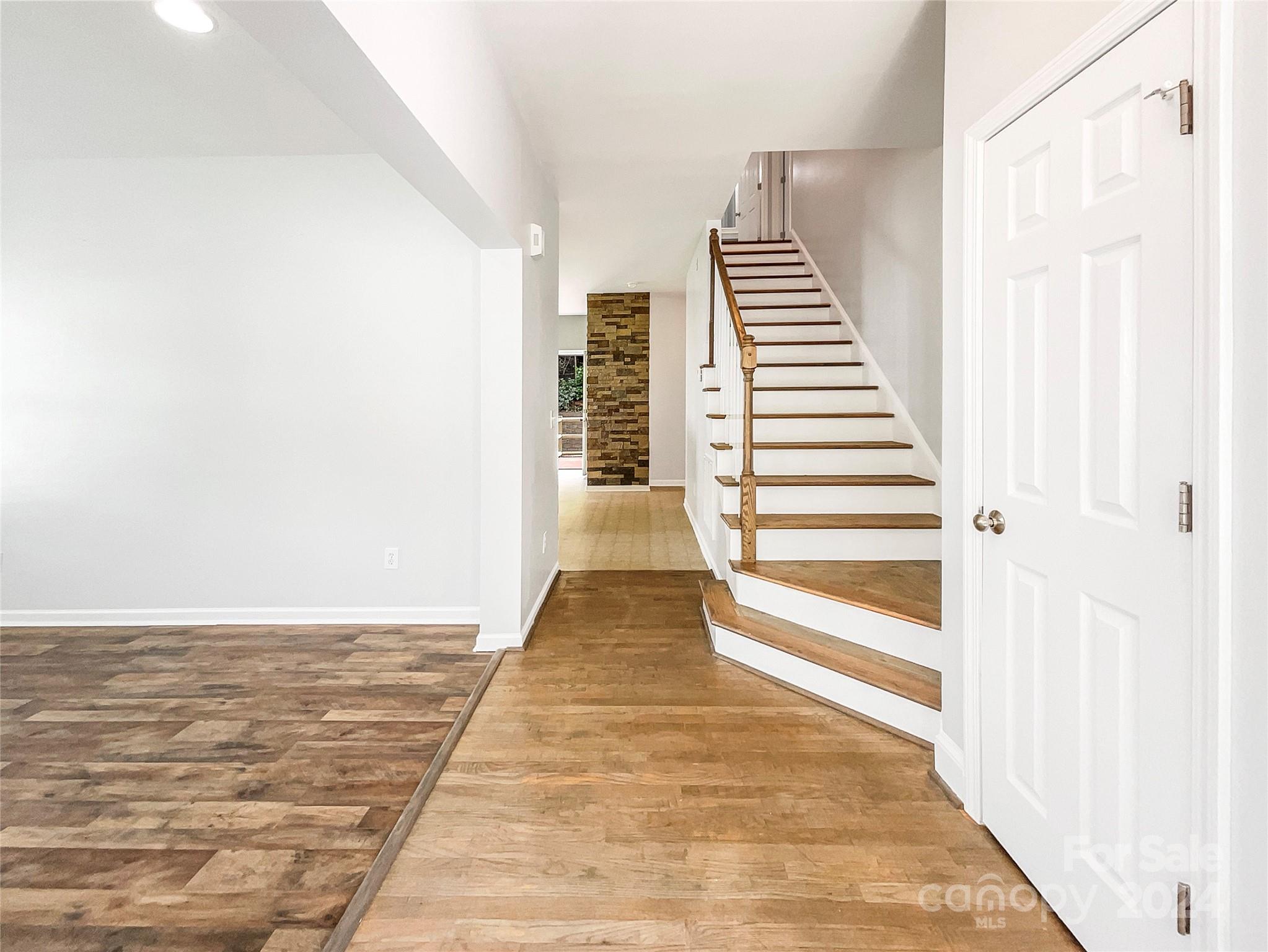 315 Lone Tree Lane Clover, SC 29710 - Photo 6 of 15 a view of a hallway with wooden floor and staircase