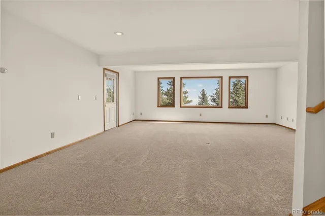 an aerial view of a house with outdoor space and street view