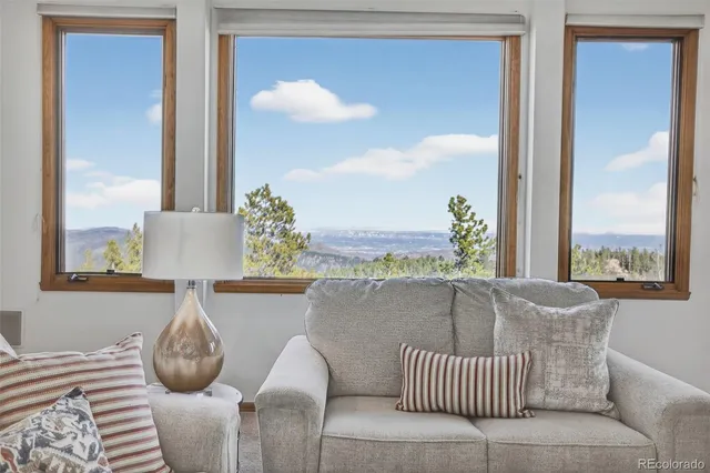 a kitchen with a stove a sink dishwasher a refrigerator and white cabinets with wooden floor