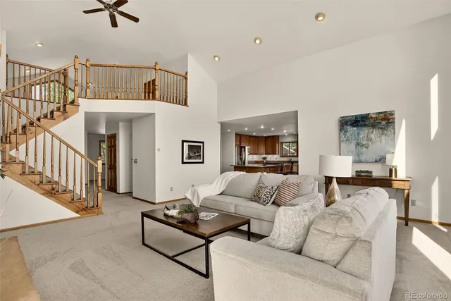 a view of a livingroom with furniture and workspace