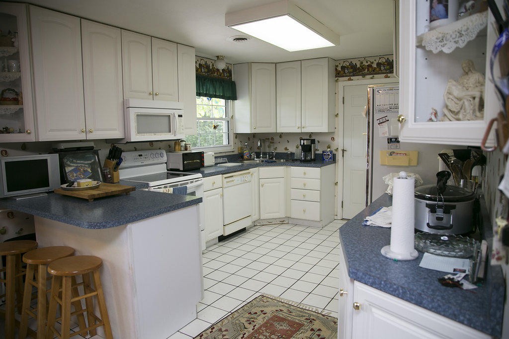 4405 Royalview Road Knoxville, TN 37921 - Photo 15 of 38 a kitchen with stainless steel appliances granite countertop a sink a stove and cabinets