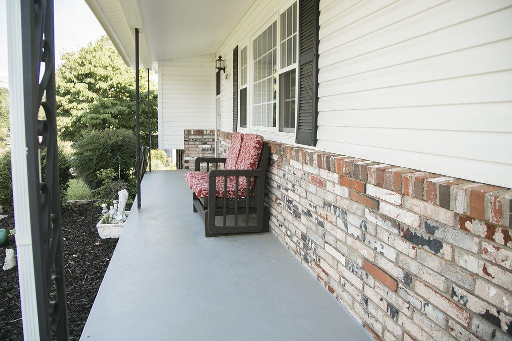 4405 Royalview Road Knoxville, TN 37921 - Photo 2 of 38 a balcony with chairs and with potted plants