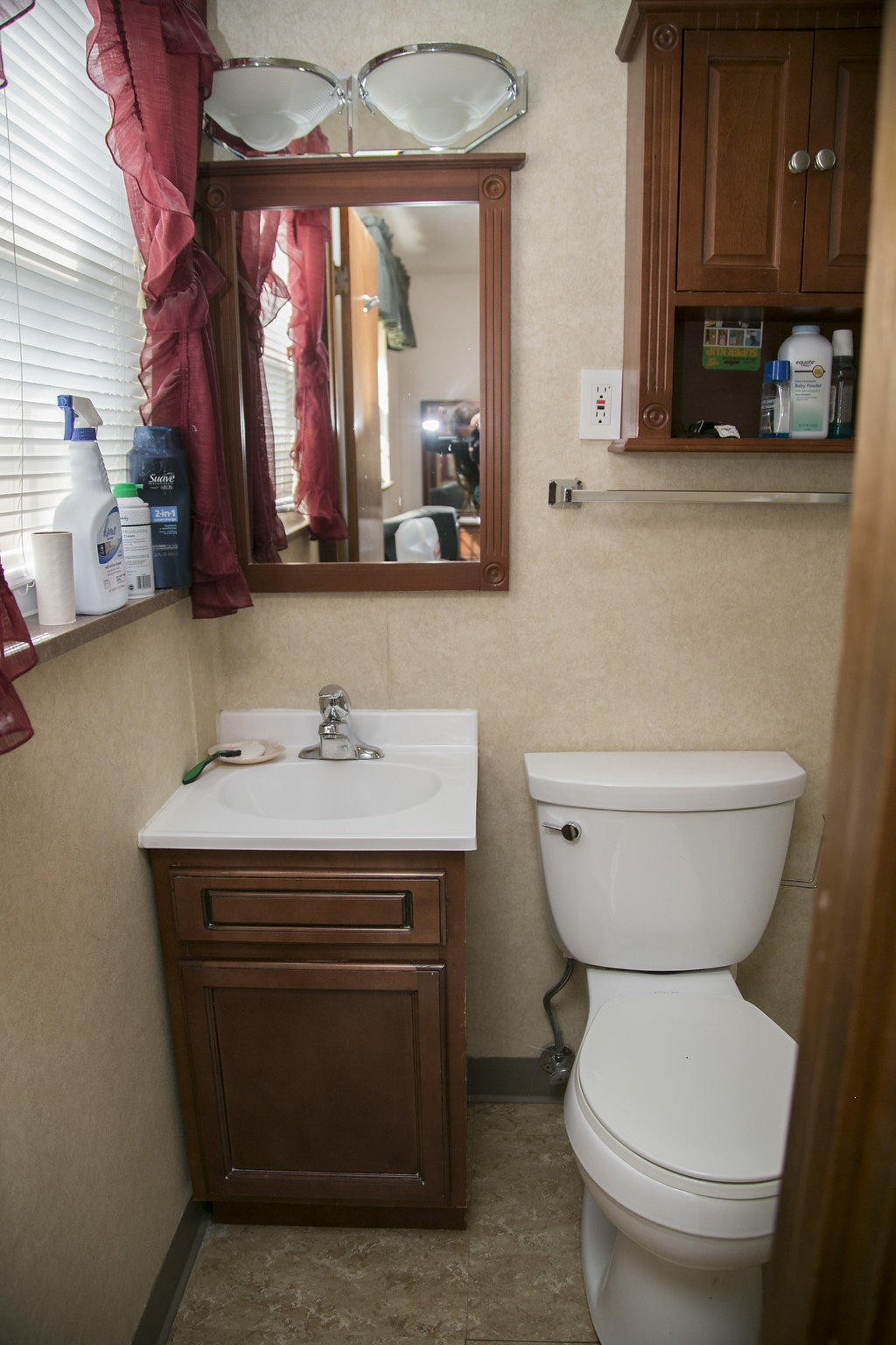 4405 Royalview Road Knoxville, TN 37921 - Photo 29 of 38 a bathroom with a granite countertop toilet sink and mirror