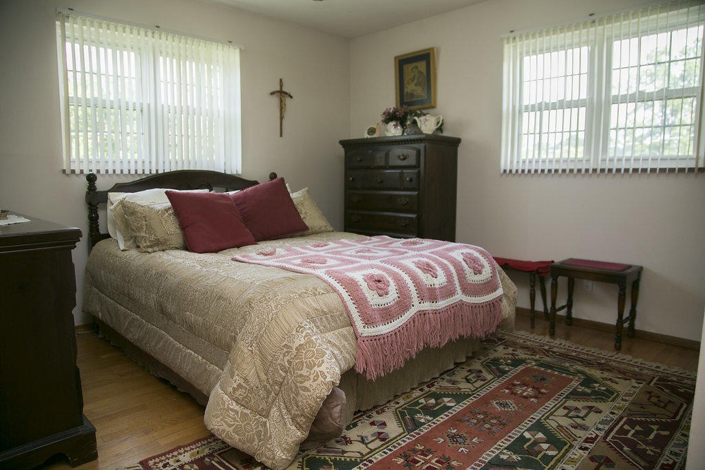 4405 Royalview Road Knoxville, TN 37921 - Photo 33 of 38 a bedroom with a bed and wooden floor