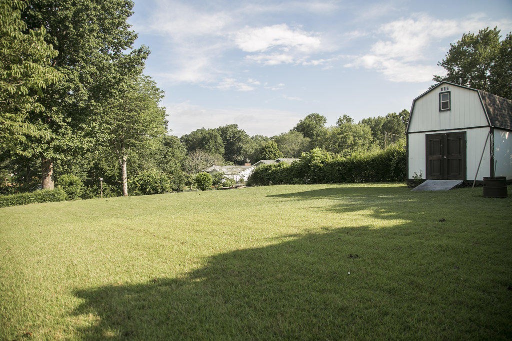 4405 Royalview Road Knoxville, TN 37921 - Photo 5 of 38 a swimming pool with outdoor seating and yard