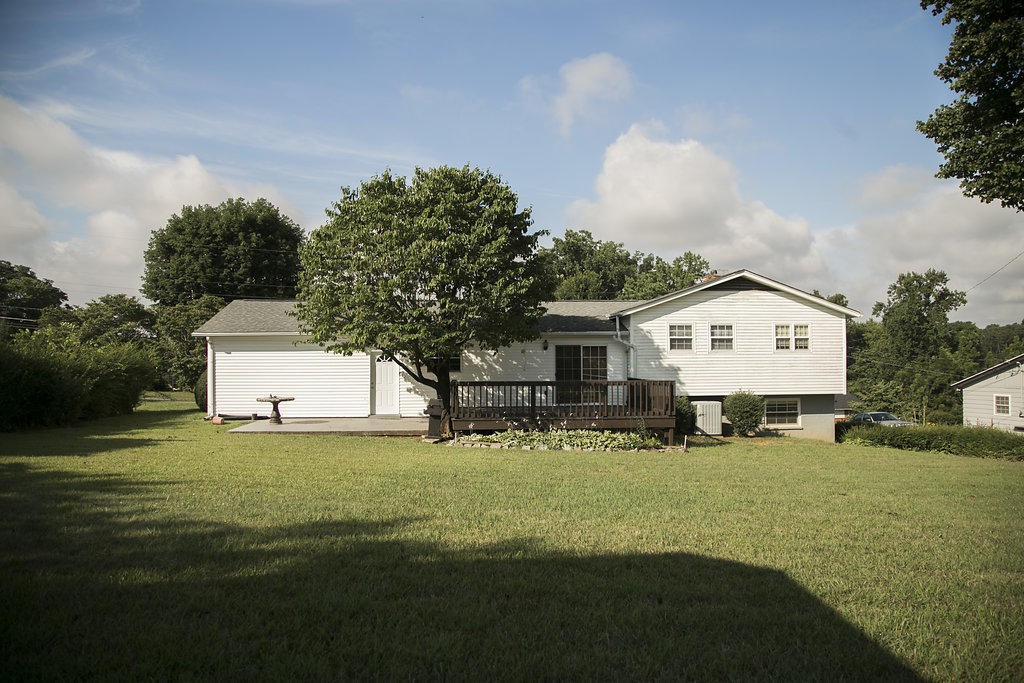 4405 Royalview Road Knoxville, TN 37921 - Photo 8 of 38 a view of a house with backyard and trees