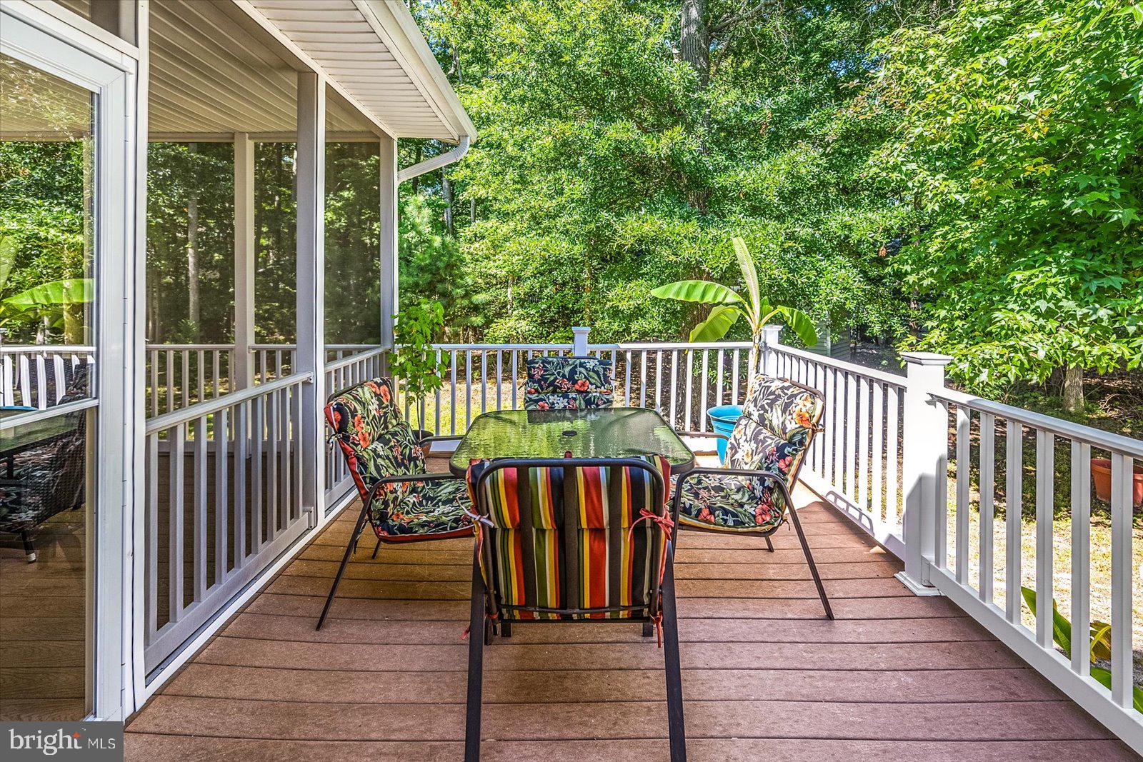 91 Robin Hood Trail Ocean Pines, MD 21811 - Photo 18 of 71 a view of a deck with two chair and wooden floor