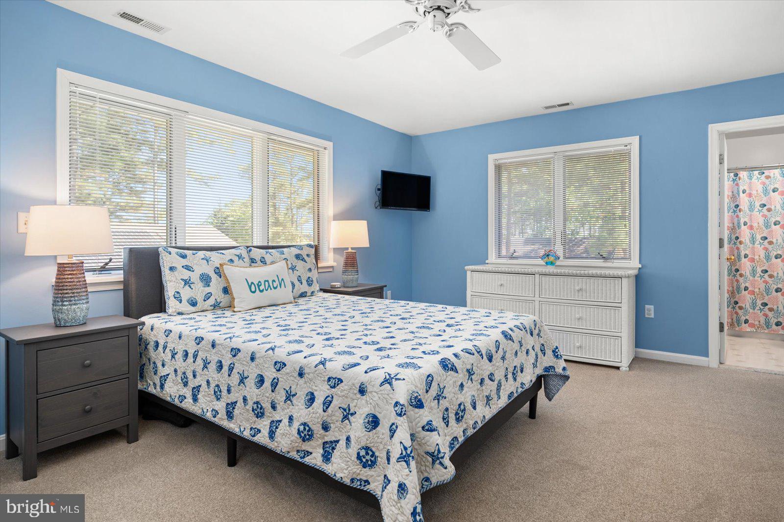 91 Robin Hood Trail Ocean Pines, MD 21811 - Photo 26 of 71 a bedroom with a large bed and a window
