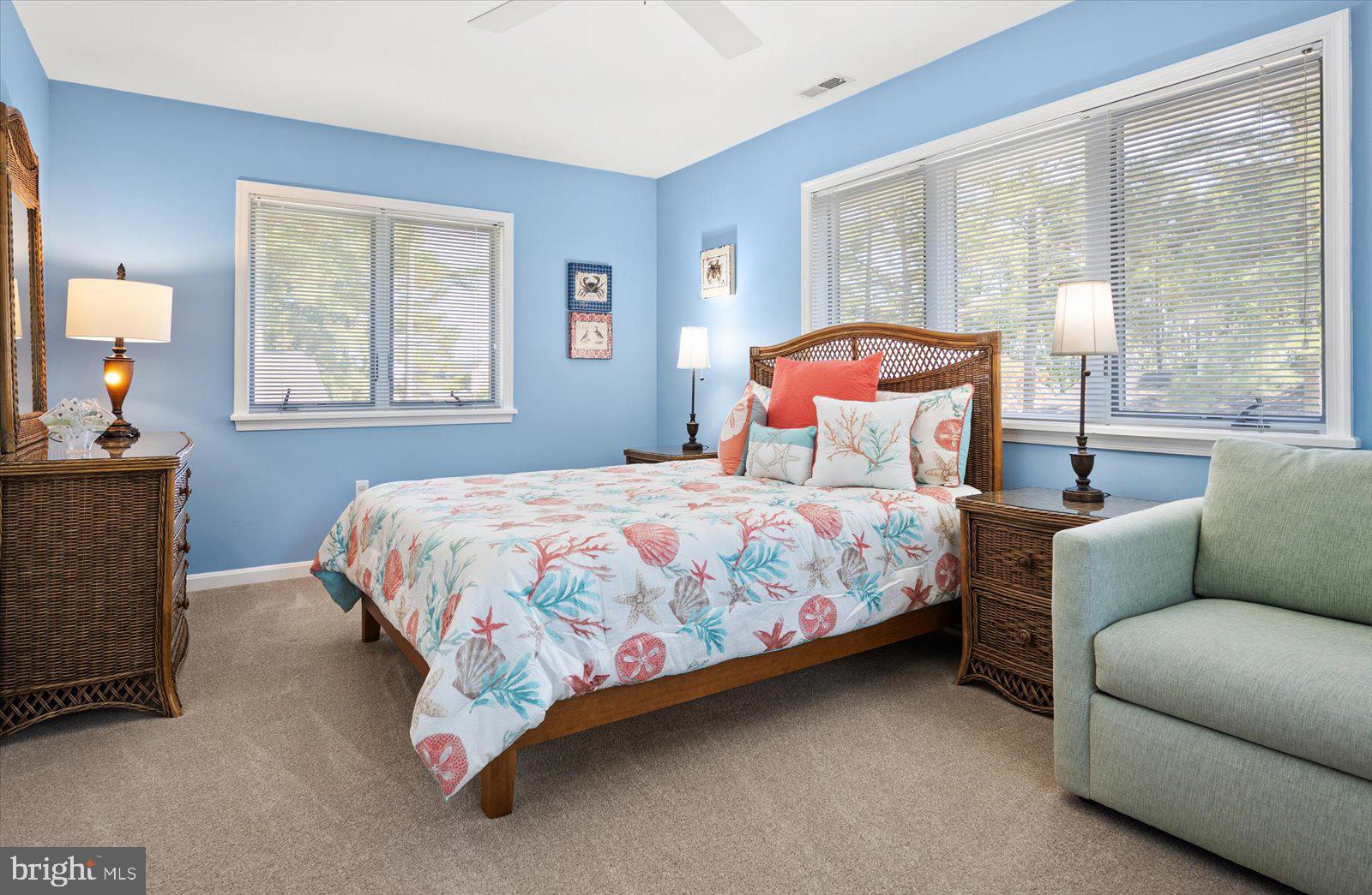 91 Robin Hood Trail Ocean Pines, MD 21811 - Photo 30 of 71 a bedroom with a bed couch and window