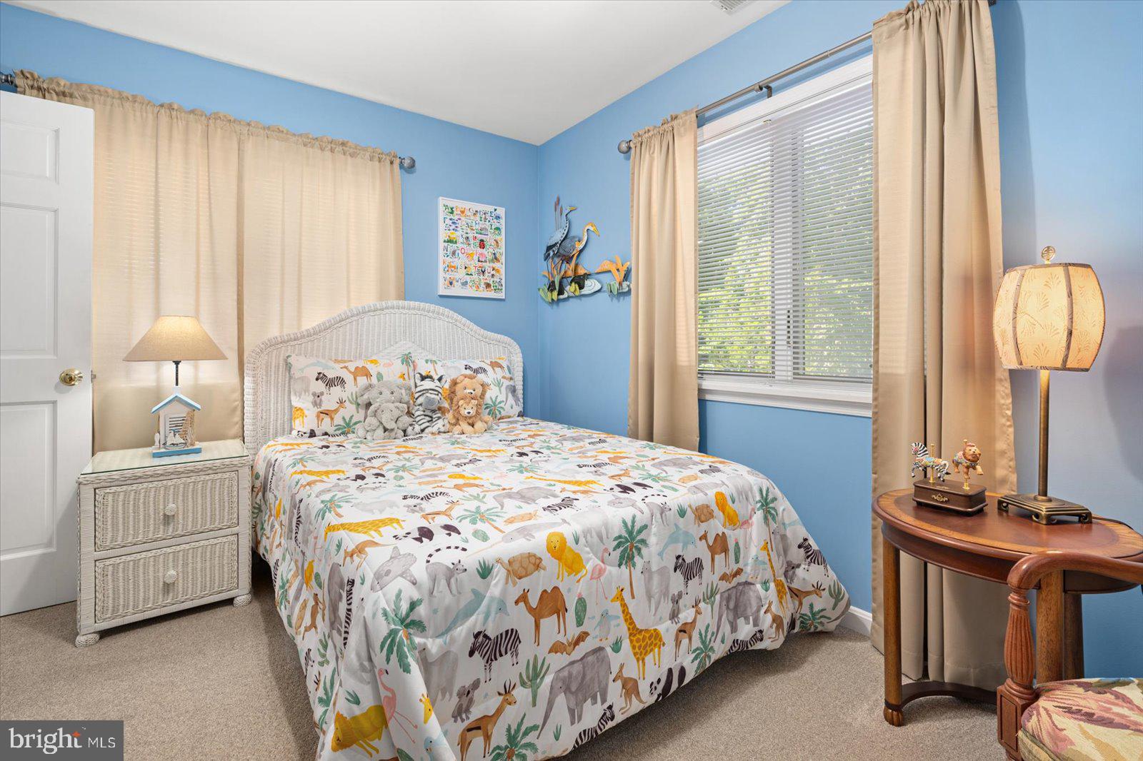 91 Robin Hood Trail Ocean Pines, MD 21811 - Photo 39 of 71 a bedroom with a bed and a large window