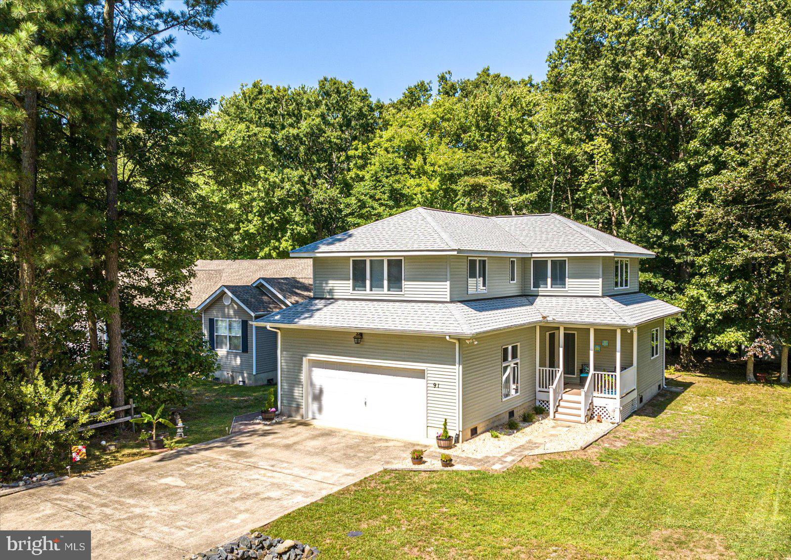 91 Robin Hood Trail Ocean Pines, MD 21811 - Photo 43 of 71 a front view of a house with a yard