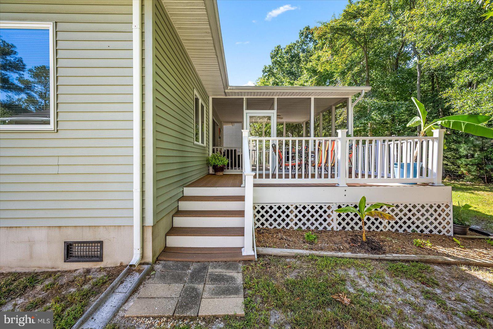 91 Robin Hood Trail Ocean Pines, MD 21811 - Photo 46 of 71 a view of a house with a small yard and wooden fence