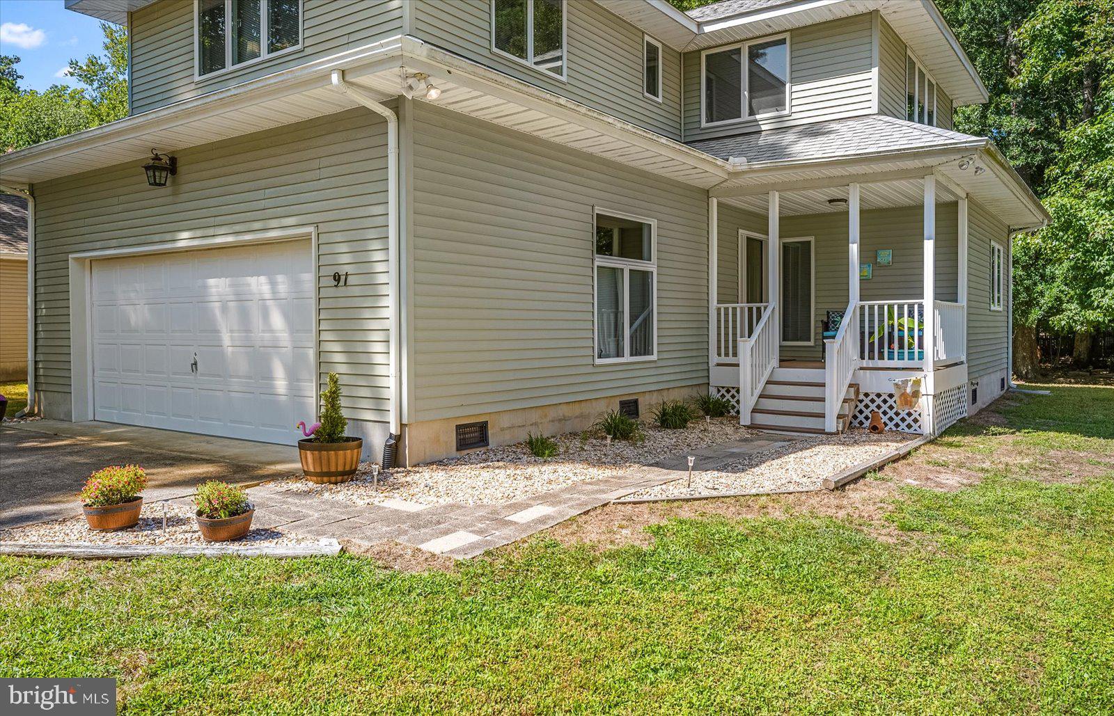 91 Robin Hood Trail Ocean Pines, MD 21811 - Photo 56 of 71 a backyard of a house with yard and outdoor seating
