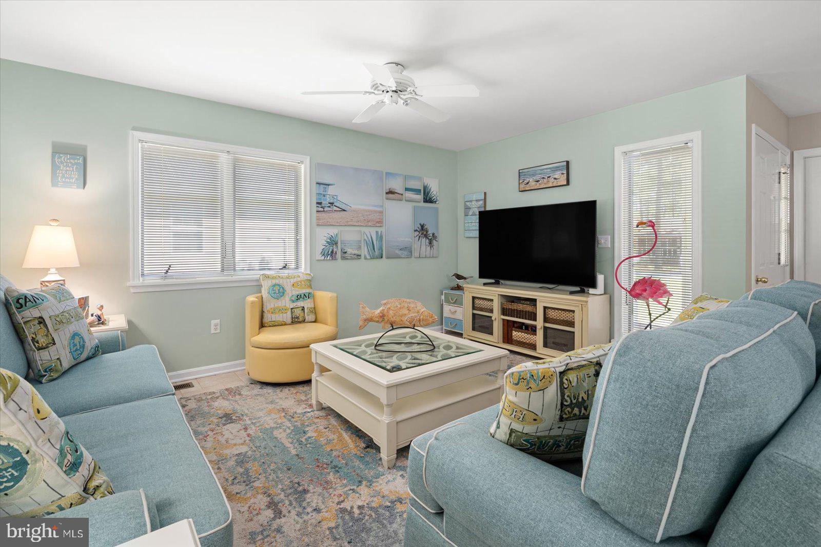 91 Robin Hood Trail Ocean Pines, MD 21811 - Photo 7 of 71 a living room with furniture and a flat screen tv