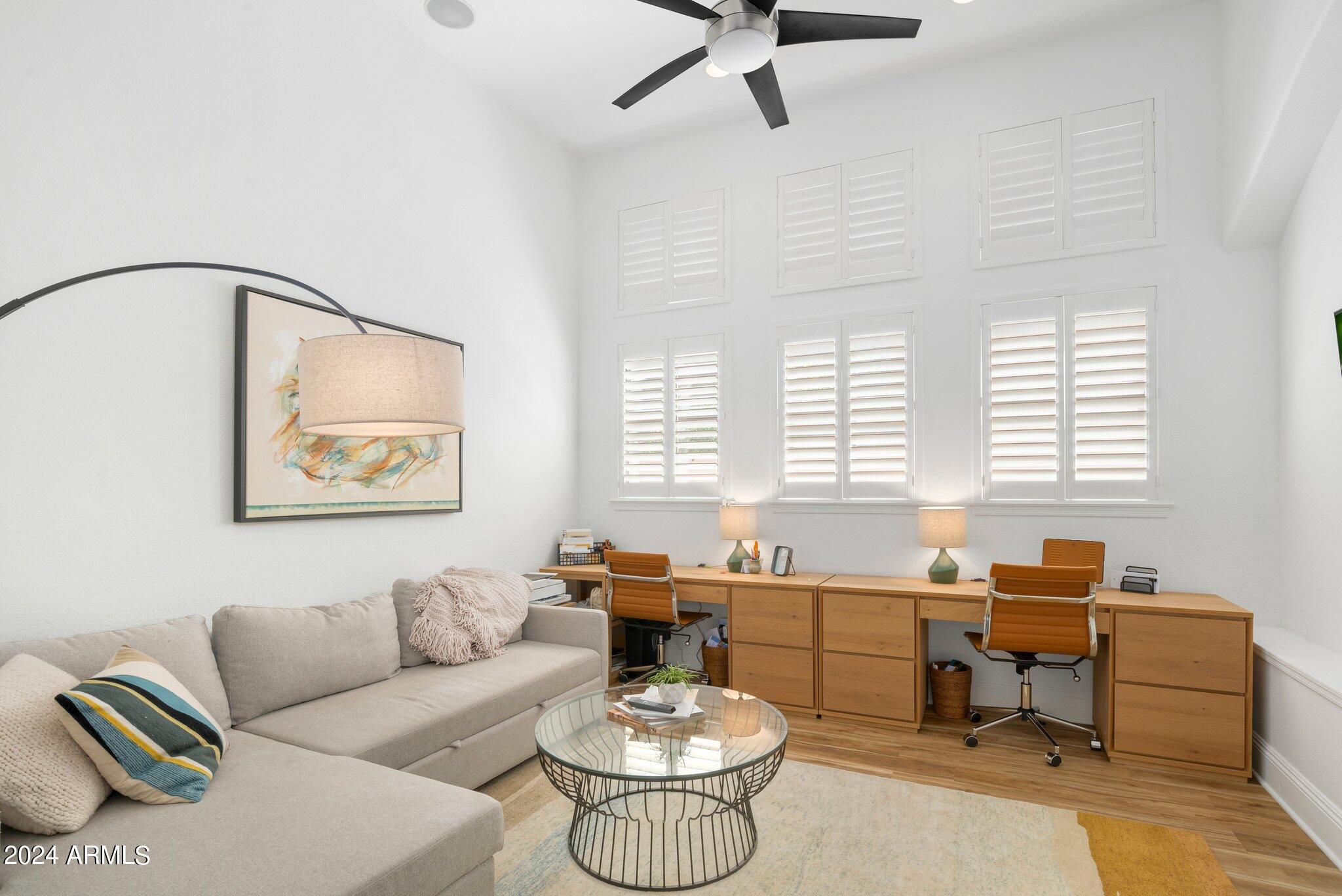 7705 East Doubletree Ranch Road, Unit 38 Scottsdale, AZ 85258 - Photo 12 of 31 a living room with furniture and a large window