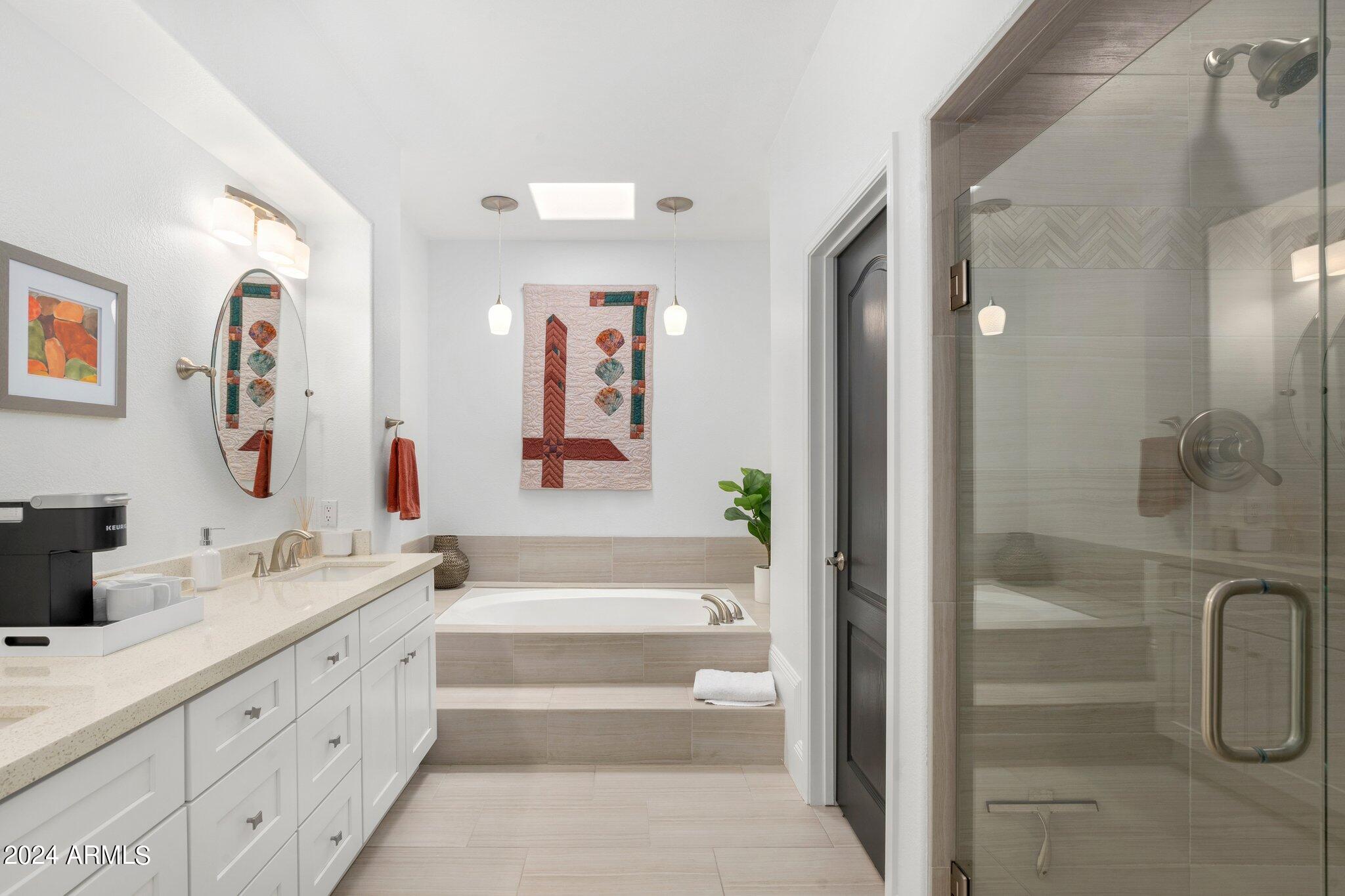7705 East Doubletree Ranch Road, Unit 38 Scottsdale, AZ 85258 - Photo 16 of 31 a bathroom with a double vanity sink toilet and shower