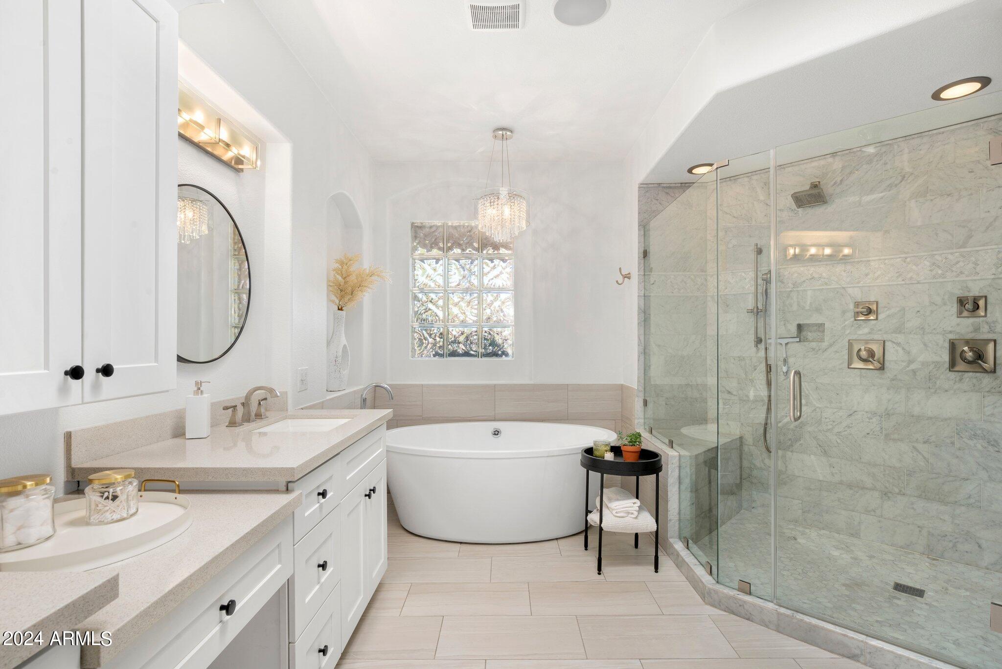 7705 East Doubletree Ranch Road, Unit 38 Scottsdale, AZ 85258 - Photo 20 of 31 a bathroom with a double vanity sink mirror and shower