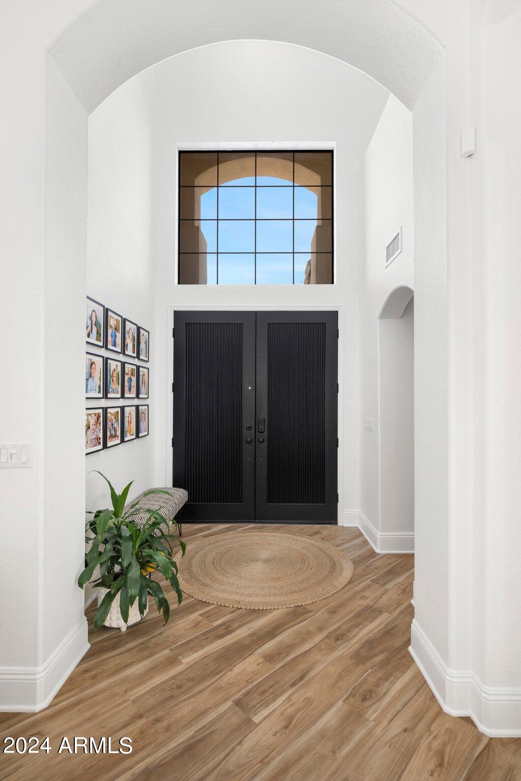 7705 East Doubletree Ranch Road, Unit 38 Scottsdale, AZ 85258 - Photo 2 of 31 a view of entryway with wooden floor