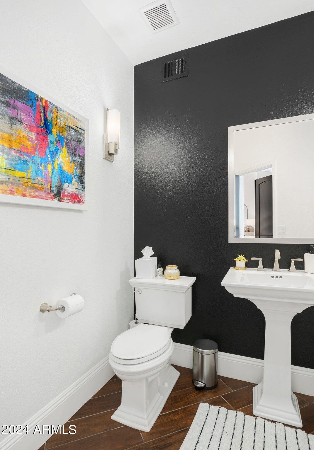 7705 East Doubletree Ranch Road, Unit 38 Scottsdale, AZ 85258 - Photo 23 of 31 a bathroom with a sink toilet and mirror