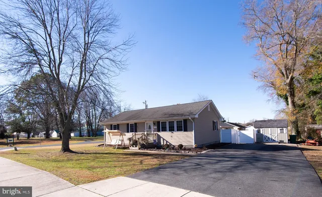 a house that has a tree in front of it