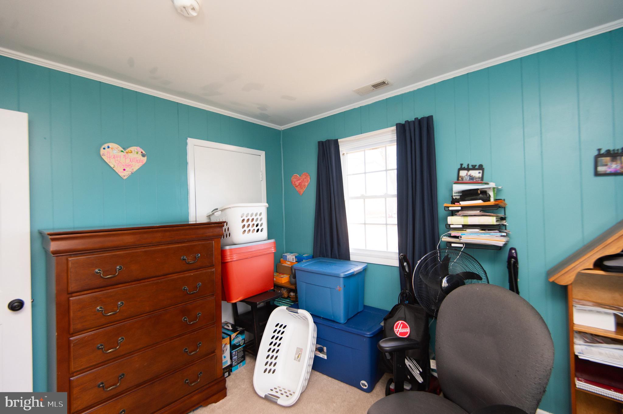 133 South Street Secretary, MD 21664 - Photo 19 of 39 a room with furniture and a window
