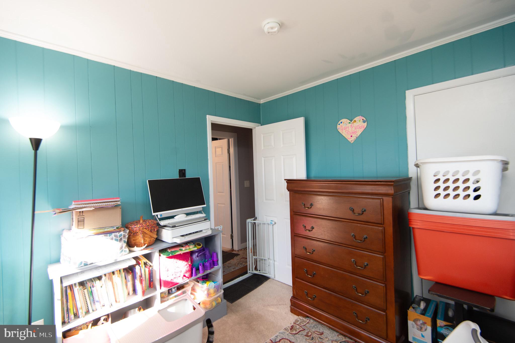 133 South Street Secretary, MD 21664 - Photo 20 of 39 a room with furniture and a flat screen tv