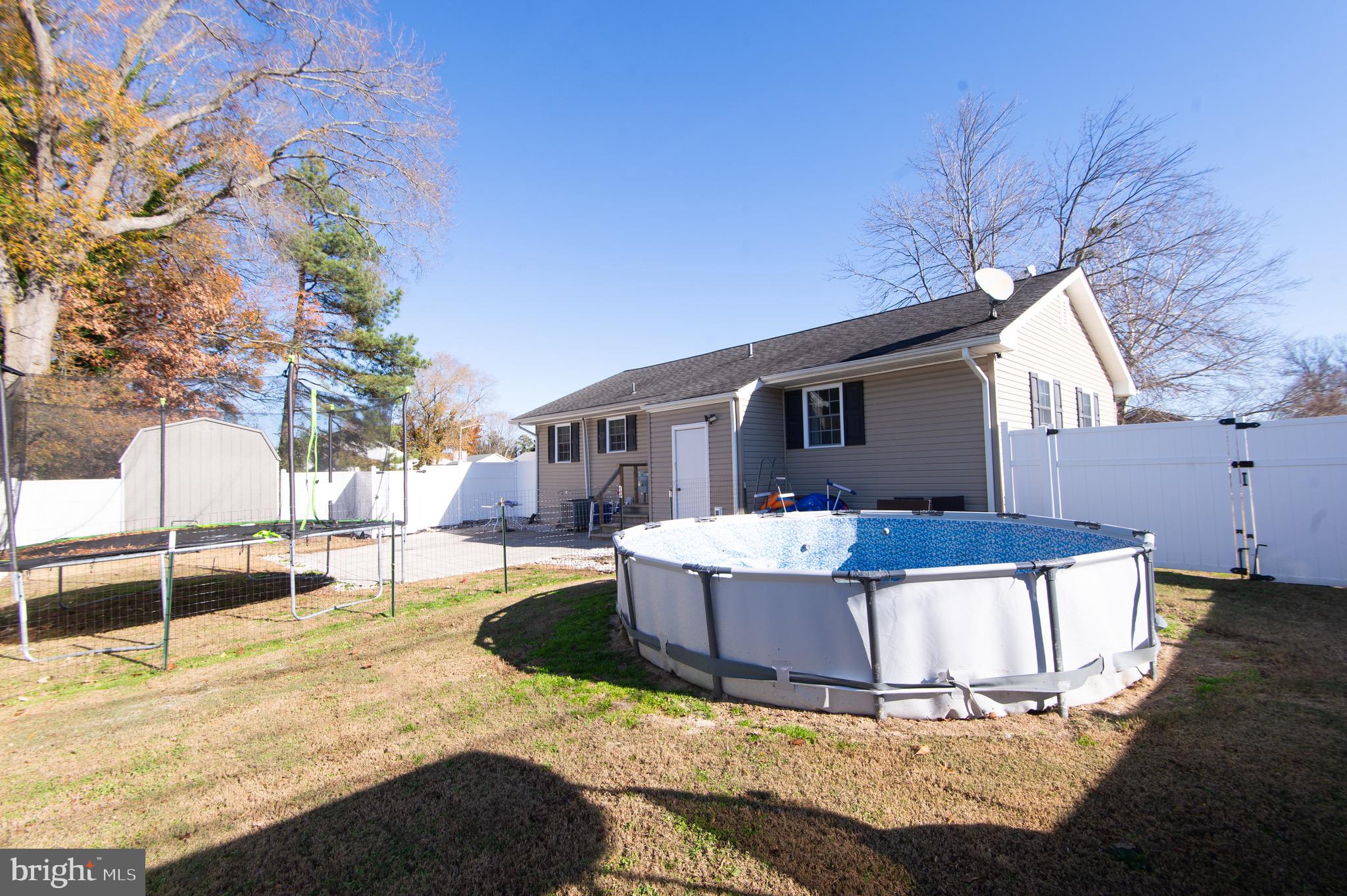 133 South Street Secretary, MD 21664 - Photo 28 of 39 a view of a house with backyard and sitting area