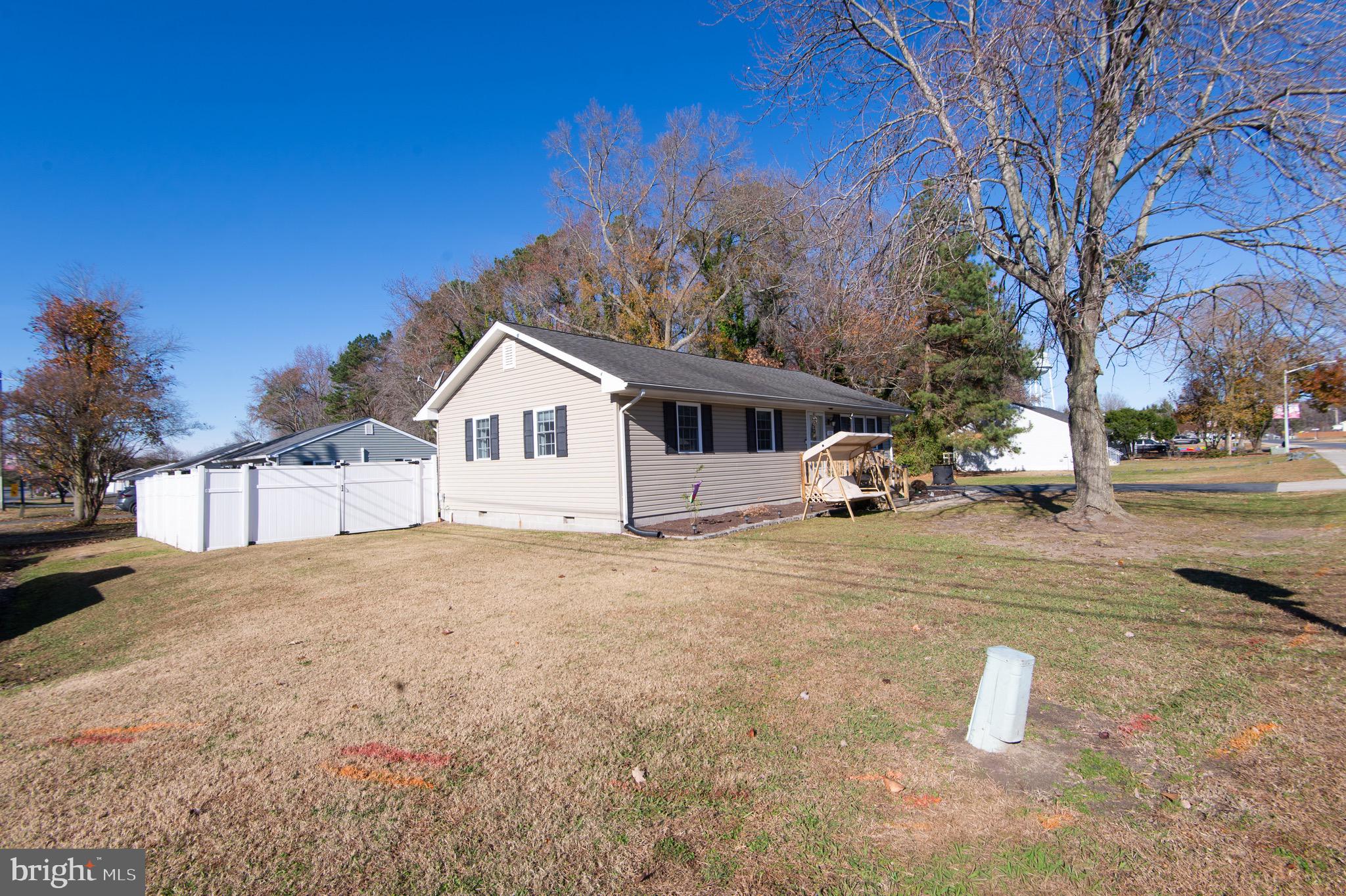 133 South Street Secretary, MD 21664 - Photo 30 of 39 a front view of a house with a yard